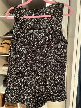 Torrid’s Black Geometric Print Sleeveless Tank with White & Red Accents